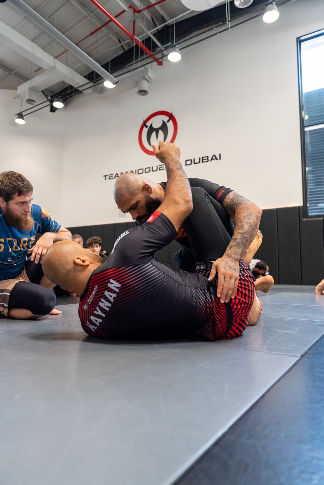 Pouya Rahmani rolling during the open mat