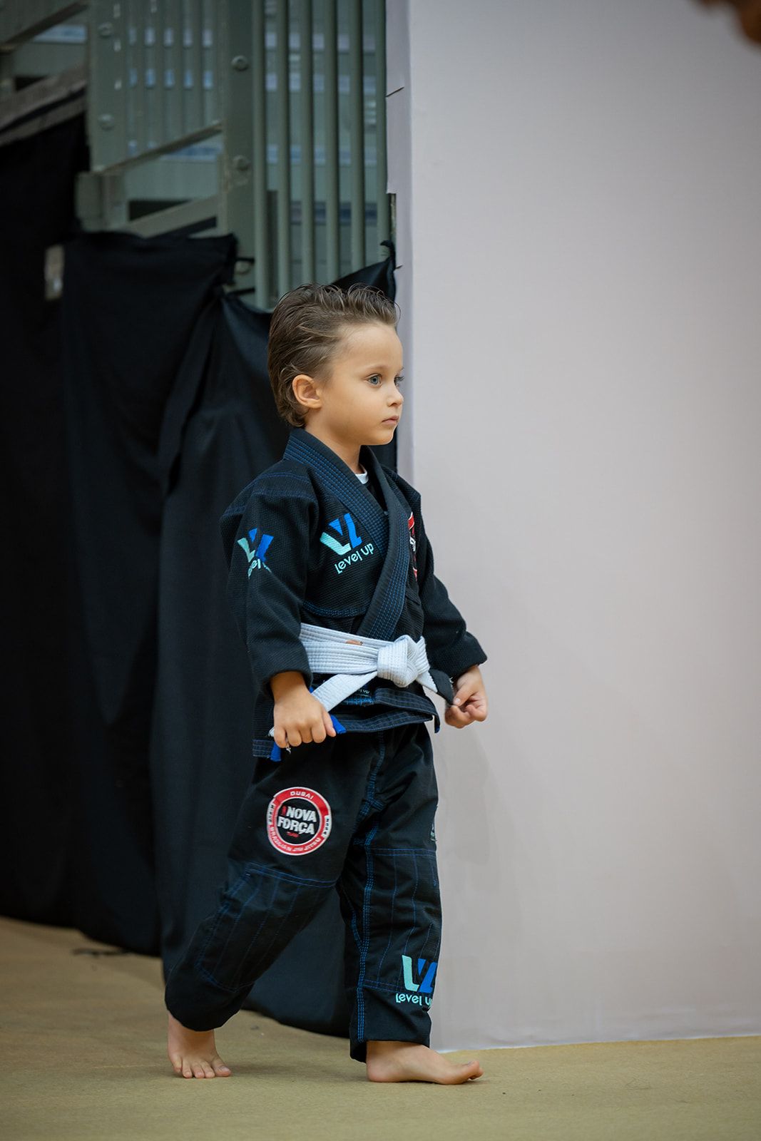Young competitor stepping onto the mat before his Jiu-Jitsu match