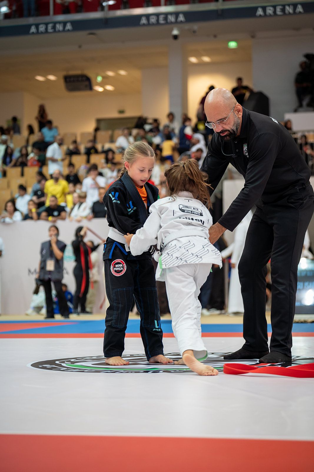 Referee starting a kids' Jiu-Jitsu match in the UAE