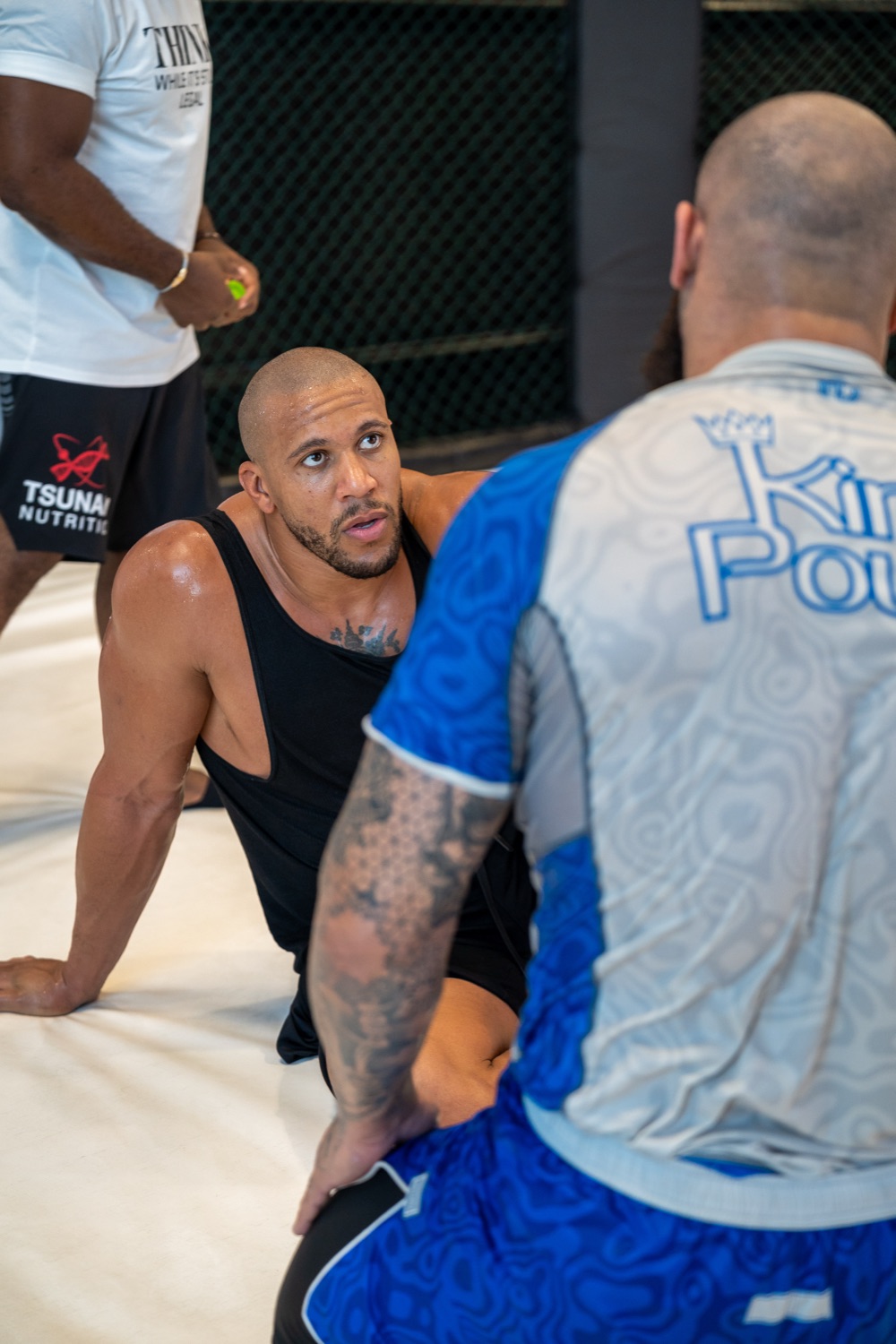 Fighter crouched and focused during fight-night warm-up
